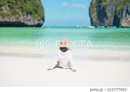 Woman tourist traveling and sightseeing in Krabi, Thailand, happy traveller enjoy at Maya Bay beach on Phi Phi island, Popular paradise island, destination, Southeast Asia Travel, vacation and holiday Woman tourist traveling and sightseeing in Krabi, Thailand, happy traveller enjoy at Maya Bay beach on Phi Phi island, Popular paradise island, destination, Southeast Asia Travel, vacation and holiday 123777983