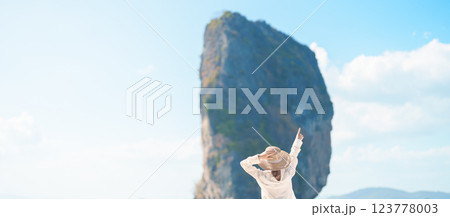 Woman tourist traveling and sightseeing in Krabi, Thailand. happy traveller enjoy on beach at Koh Poda island. summer trip, destination, Southeast Asia Travel, vacation and holiday concept 123778003