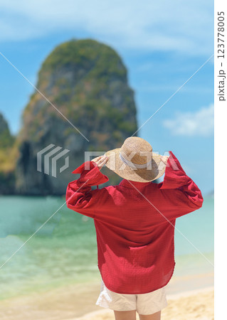 Woman tourist travel and sightseeing in Krabi, Thailand. happy traveller enjoy on beach at Phra nang Cave Beach near Railay Beach. summer trip, destination, Southeast Asia Travel and vacation concept 123778005
