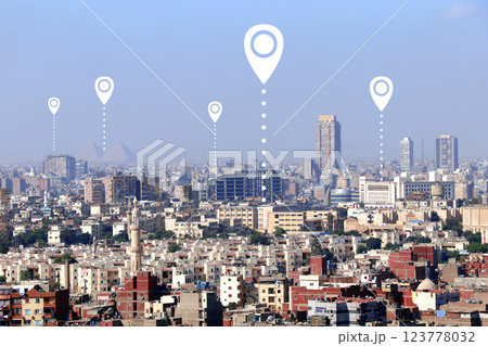 Planning a tourist trip. Top view of Cairo with Great Pyramids and location pin. Travel way,  find trip, point navigation concept. Global positioning system pin map. Modern travel, sightsee, tourism 123778032
