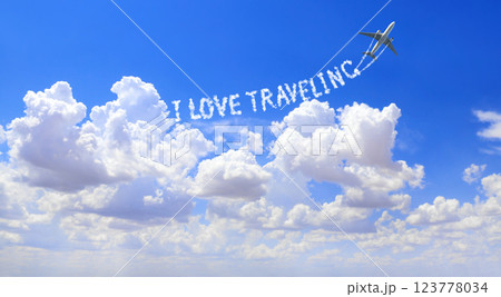 Blue sky with aircraft and Jet trailing smoke. Horizontal banner with airplane drawing a word I love traveling in sky. Topic of summer holiday, travel, trip abroad on vacation, cruises and tours 123778034