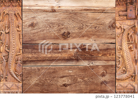 Horizontal background with wood carving frames with traditional moroccan wood carving with animals - crocodile, turtle. Ancient decorative carved border on wooden surface. Copy space for text 123778041