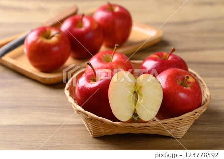 Red apple fruit (Gala apple) in basket on wooden background 123778592