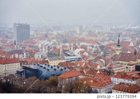 Graz cityscape on foggy day. Panoramic view of Graz, Austria with historical architecture. Streets with red roofed buildings in European city 123779394