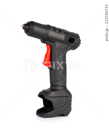 Cordless hot glue gun isolated on a white background. Black and red ergonomic design 123780733