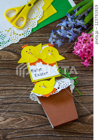 Child gift postcard happy easter chickens toy on a wooden table. Handmade. Project of childrens creativity, handicrafts, crafts for kids. Child gift postcard happy easter chickens toy on a wooden table. Handmade. Project of childrens creativity, handicrafts, crafts for kids. 123781919