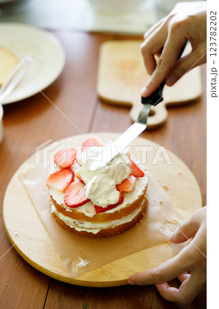 Homemade strawberry shortcake topped with fresh strawberries. 123782202