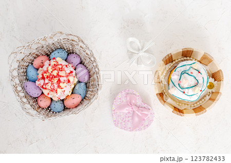 Easter cakes and colorful Easter eggs in the wooden baskets. 123782433