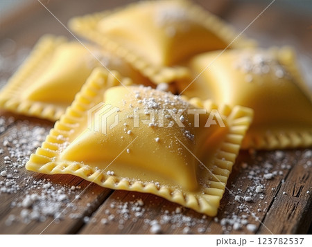 Artisanal Italian Handcrafted Ravioli Pasta with Traditional Crimped Edges on Rustic Wooden Surface A Culinary Craftsmanship Display 123782537