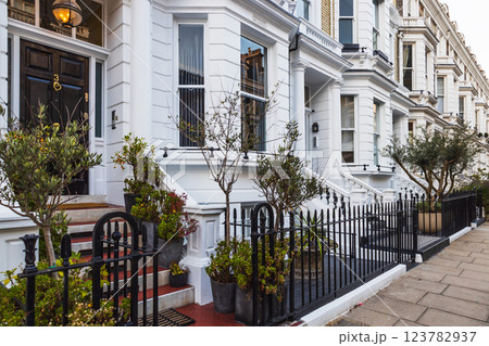 Classic Victorian Townhouses with Ornate Balconies and Lovely Front Gardens Classic Victorian Townhouses with Ornate Balconies and Lovely Front Gardens 123782937
