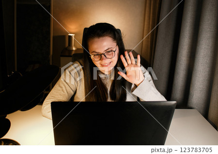 Businesswoman having virtual work meeting using laptop. Freelance worker sitting at home participates in video conference. 123783705