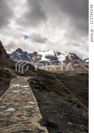 Stone trail leading to Pastoruri Glacier, Huaraz, Peru, amidst rugged mountains Stone trail leading to Pastoruri Glacier, Huaraz, Peru, amidst rugged mountains 123784148