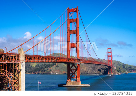 Golden Gate Bridge over blue waters with scenic hills in San Francisco Golden Gate Bridge over blue waters with scenic hills in San Francisco 123784313