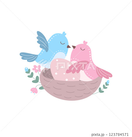 Two birds sit in a nest 123784571