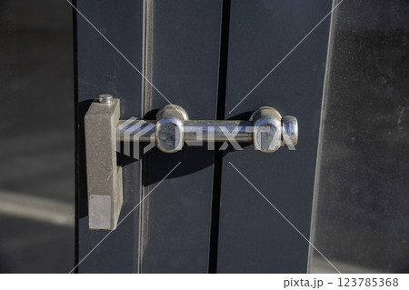 Lock on a warehouse doors Lock on a warehouse doors 123785368