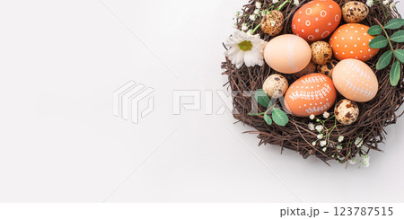 Easter nest with hand-painted eggs on a light background Easter nest with hand-painted eggs on a light background 123787515
