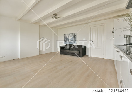 A clean, modern interior showcasing a minimalist living room with soft lighting and neutral tones, ideal for creating a serene atmosphere. A clean, modern interior showcasing a minimalist living room with soft lighting and neutral tones, ideal for creating a serene atmosphere. 123788433