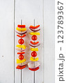 Vegetable kebab on skewers on a light wooden background 123789367