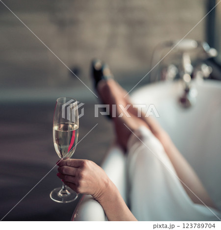 Woman feet in bathrobe at home, closeup 123789704