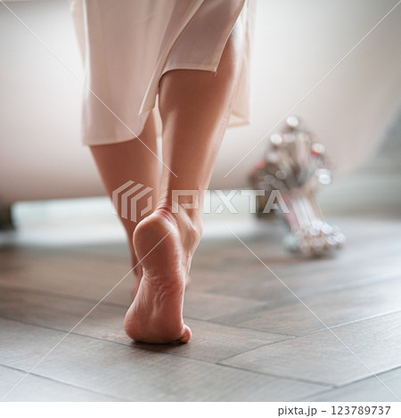 Woman feet in bathrobe at home, closeup 123789737