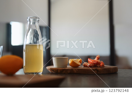 Crab legs with lemon and dressing on olive woob board 123792148
