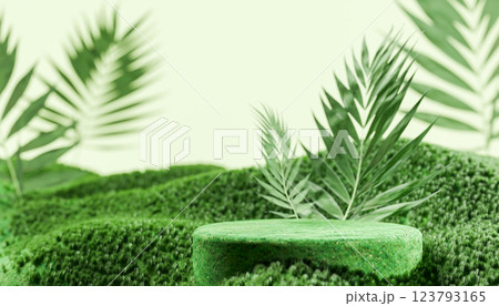 Empty green podium for product placement of natural cosmetics in 3D rendering setting with lush greenery and palm leaves, showcasing eco-friendly beauty product 123793165