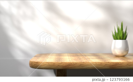Wooden table surface, empty backdrop for product placement, simple and clean space, neutral background, bright and natural light, modern workspace design, advertising backdrop 123793166