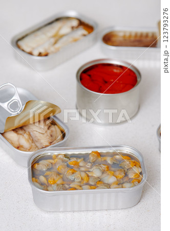 closeup of some open cans of food on the kitchen 123793276