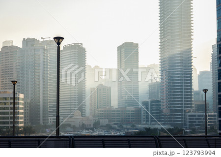 Smog fog in the city from car exhaust gases, multi-story buildings in a light haze Smog fog in the city from car exhaust gases, multi-story buildings in a light haze 123793994