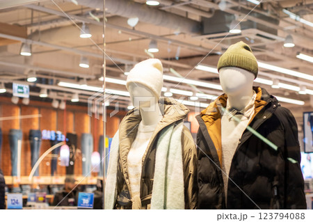 A mannequin in a hat stands beside another mannequin A mannequin in a hat stands beside another mannequin 123794088