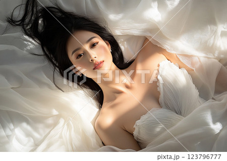 serene portrait of woman in flowing white dress, surrounded by soft fabric, exuding elegance and beauty. Her calm expression enhances ethereal atmosphere serene portrait of woman in flowing white dress, surrounded by soft fabric, exuding elegance and beauty. Her calm expression enhances ethereal atmosphere 123796777