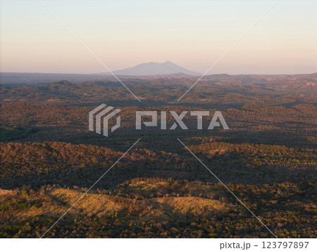 Majestic landscape showing rolling hills and distant mountains at sunset Majestic landscape showing rolling hills and distant mountains at sunset 123797897