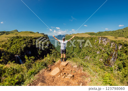 Traveller man enjoying on cliff in Espraiado canyon park in Santa Catarina, Brazil. 123798060