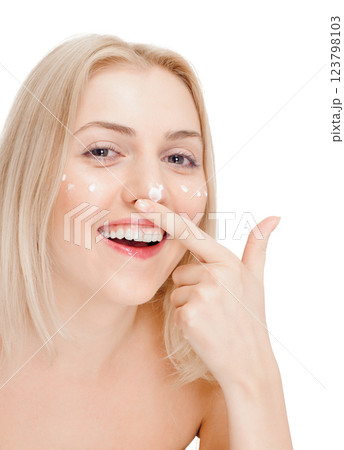Woman applying face cream Woman applying face cream 123798103