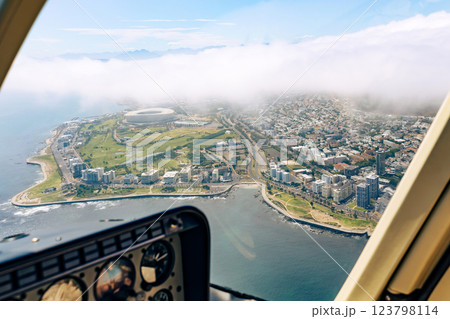 View from the cockpit of the helicopter on Cape Town and clouds 123798114