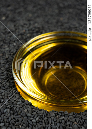 Unrefined cold pressed sesame oil in a glass bowl. Unrefined cold pressed sesame oil in a glass bowl. 123799082