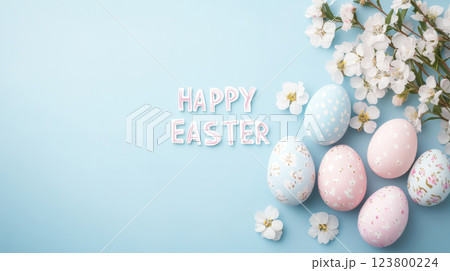 Easter eggs and cherry blossoms on pastel blue wood table background Easter eggs and cherry blossoms on pastel blue wood table background 123800224