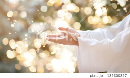 Hand of Jesus reaching out with light in spiritual scene, religious concept background 123800227