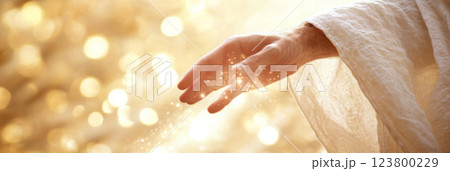 Hand of Jesus reaching out with light in spiritual scene, religious concept background Hand of Jesus reaching out with light in spiritual scene, religious concept background 123800229