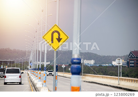 Sign showing the U-turn lane in front 123800269