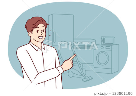 Man appliances salesman points finger at washing machine and vacuum cleaner with refrigerator 123801190