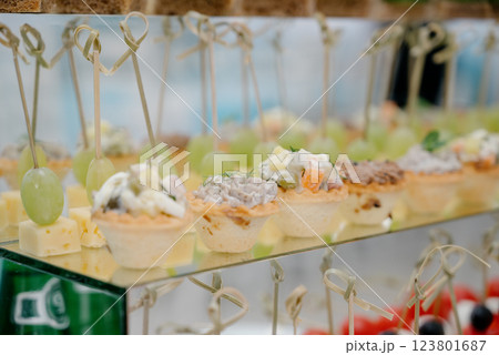 Cheese canapes with wine on table. Catering. Cheese canapes with wine on table. Catering. 123801687