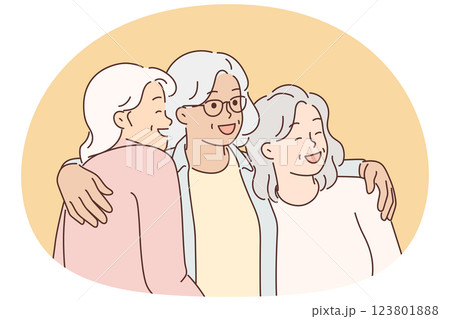Three elderly women laugh and hug for first time having met after long separation Three elderly women laugh and hug for first time having met after long separation 123801888