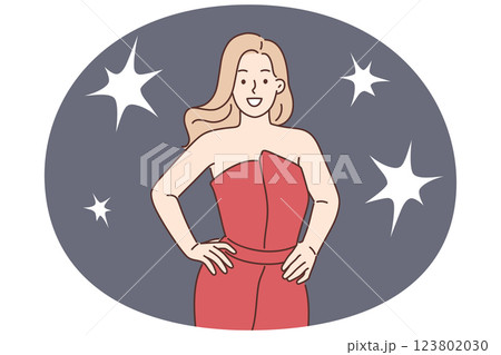Celebrity woman poses for reporters standing in evening dress during film festival or award ceremony Celebrity woman poses for reporters standing in evening dress during film festival or award ceremony 123802030