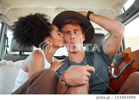 Couple, car and road trip with funny face, together and kiss on travel, vacation or holiday together on the road. Woman, man and comic time with love, happiness and joke in transport in Houston 123803099