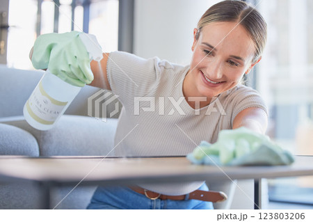 Woman spring cleaning home furniture with spray product, cloth and living room table. Happy cleaner service, maid and housekeeper liquid bottle disinfection task, dust and routine apartment lifestyle Woman spring cleaning home furniture with spray product, cloth and living room table. Happy cleaner service, maid and housekeeper liquid bottle disinfection task, dust and routine apartment lifestyle 123803206