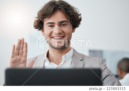 Video call, wave and businessman in a meeting on the internet while working in an office at work. Corporate employee greeting hello, waving and in communication on digital webinar with laptop Video call, wave and businessman in a meeting on the internet while working in an office at work. Corporate employee greeting hello, waving and in communication on digital webinar with laptop 123803315