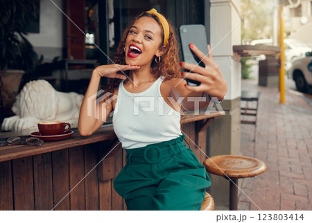Selfie, phone and coffee shop with a black woman taking a photograph for social media post. 5g mobile technology, cafe and app with a female customer taking a picture at an outdoor restaurant Selfie, phone and coffee shop with a black woman taking a photograph for social media post. 5g mobile technology, cafe and app with a female customer taking a picture at an outdoor restaurant 123803414