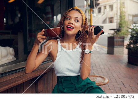 Phone, outdoor cafe and trendy woman or customer listening to audio at a coffee shop on the sidewalk. Fashion, internet and communication with a young female drinking coffee and enjoying city life 123803472