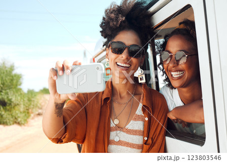Selfie, smile and friends on a road trip with a car during a safari holiday in Kenya. African women with phone for photo, communication and social media live streaming on vacation in the desert 123803546